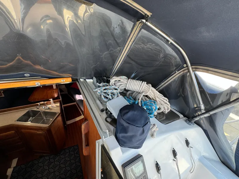 Interior view of a 1992 Hunter 35 sailboat with ropes and equipment.