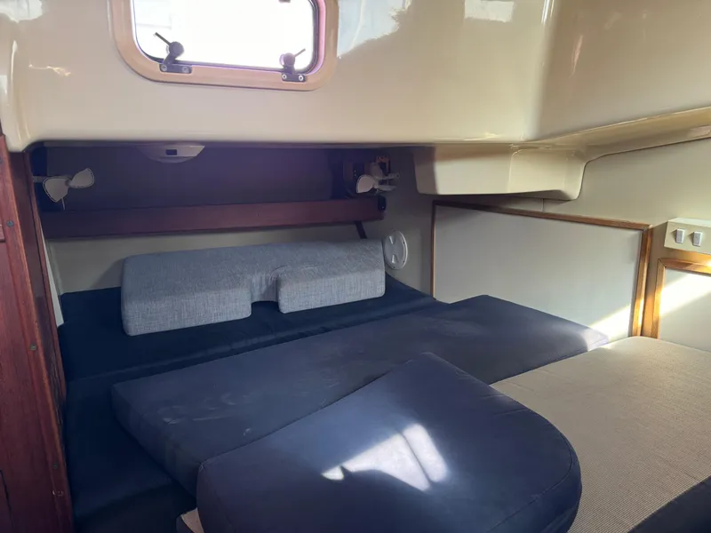 Interior cabin of a 1992 Hunter 35 sailboat with cushioned seating.