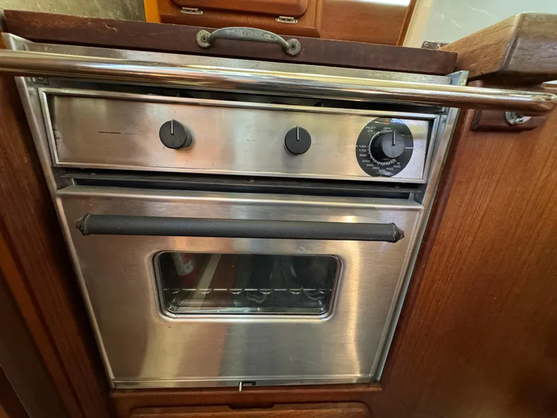 Stainless steel oven in a 1992 Hunter 35 boat kitchen.