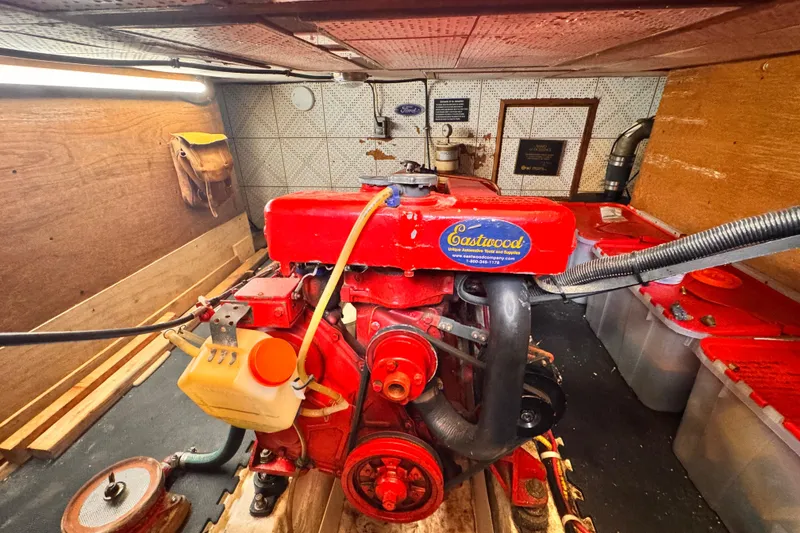 Engine room of a 1980 Hershine Trawler with a red Eastwood engine.