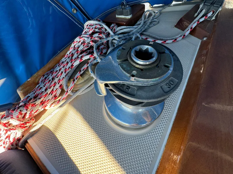 Winch and ropes on 1987 Catalina 34 sailboat deck.