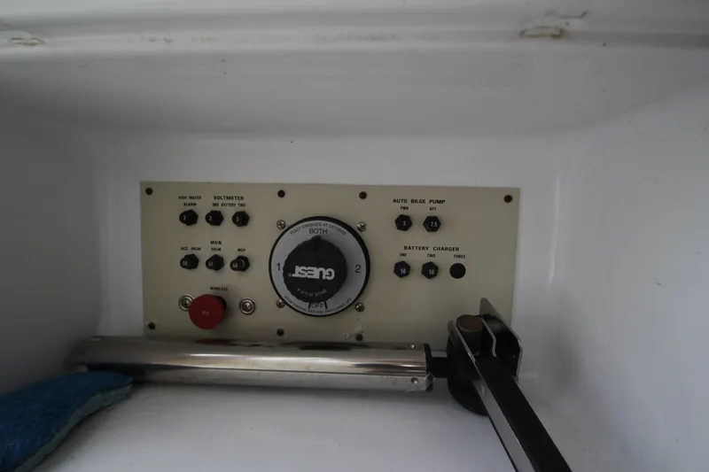 A control panel with various switches and a large dial.