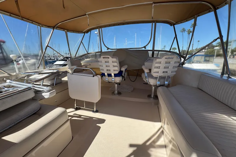 Interior view of a 2006 Mainship 34 Trawler with seating and helm station.