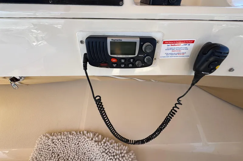 VHF radio on 2006 Mainship 34 Trawler, featuring Raymarine equipment.