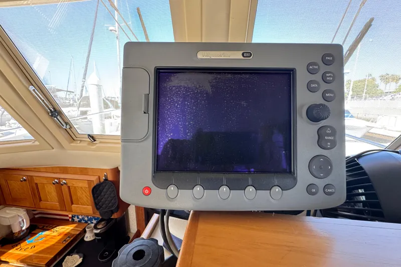 Navigation system on 2006 Mainship 34 Trawler boat dashboard.