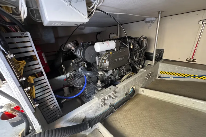 Engine room of 2006 Mainship 34 Trawler showcasing Yanmar engine components.