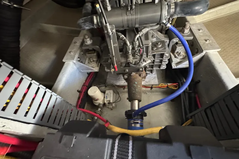 Engine compartment of a 2006 Mainship 34 Trawler with visible wiring and components.