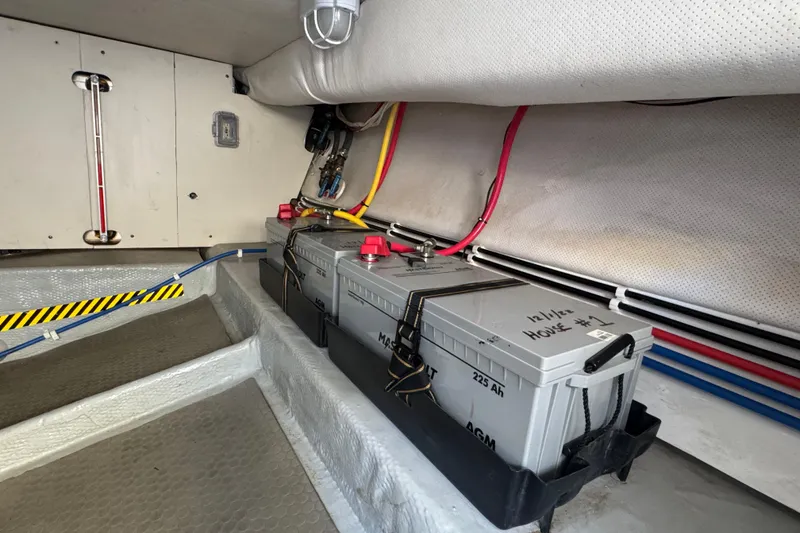 Battery compartment of 2006 Mainship 34 Trawler with AGM batteries and wiring.