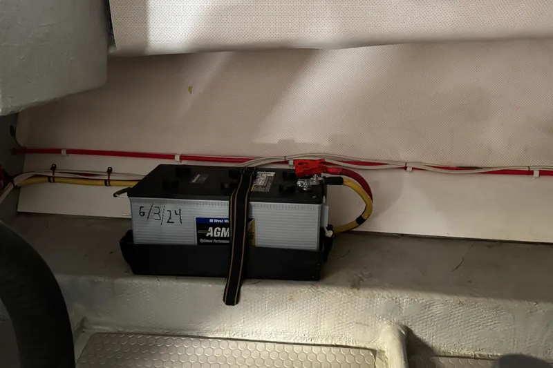 Battery compartment of a 2006 Mainship 34 Trawler with AGM battery installed.