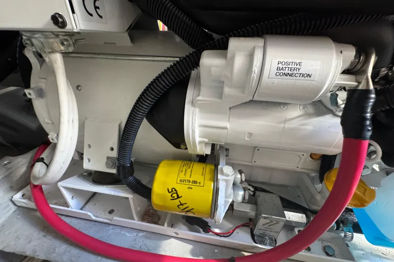 Engine compartment of a 2006 Mainship 34 Trawler with battery connection.