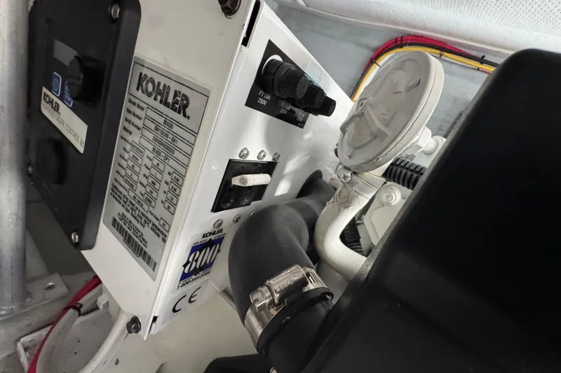 Engine room of 2006 Mainship 34 Trawler featuring Kohler generator.
