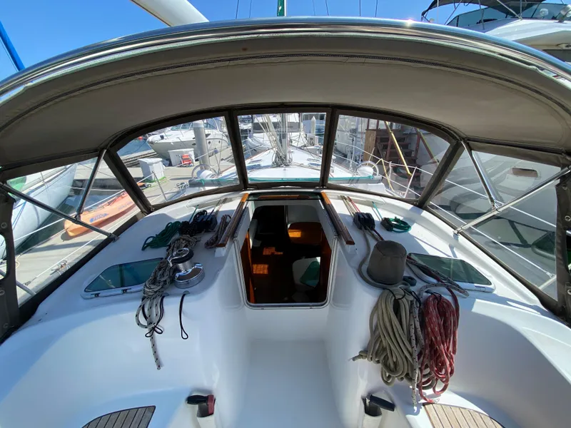Cockpit view of a 2003 Beneteau 423 sailboat docked at a marina.