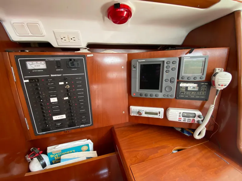 Navigation and control panel inside a 2003 Beneteau 423 sailboat cabin.