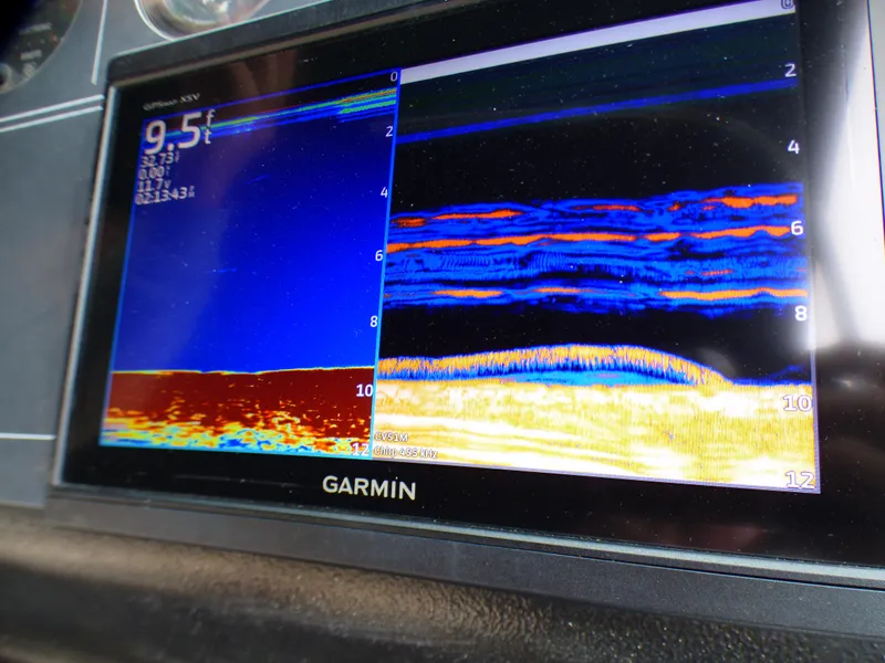 Garmin fishfinder display on 1989 Tiara Yachts 3300, showing underwater sonar readings.
