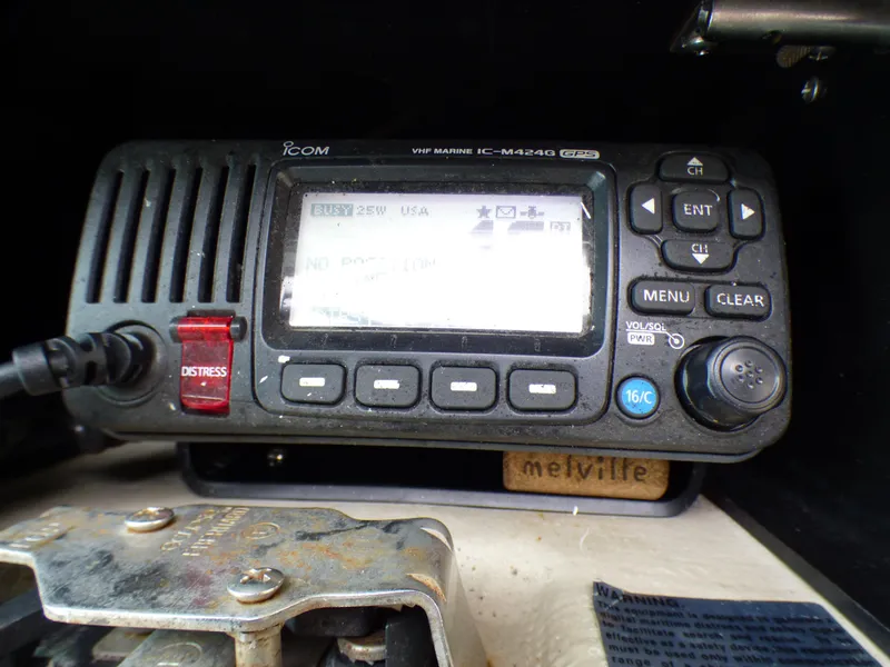 VHF marine radio on 1989 Tiara Yachts 3300, featuring distress button and control panel.