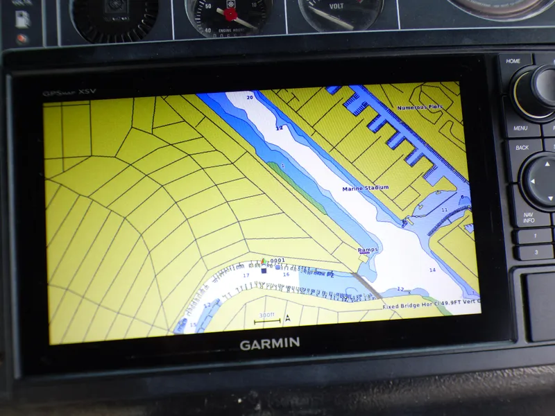 Garmin GPS displaying nautical map on 1989 Tiara Yachts 3300 dashboard.