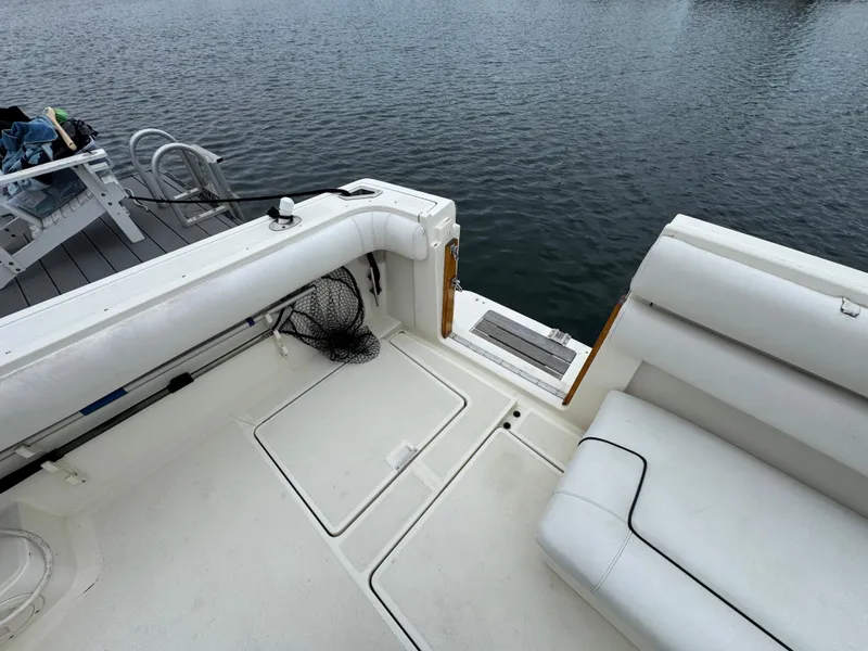 1989 Tiara Yachts 3300 boat interior with white seating and water view.