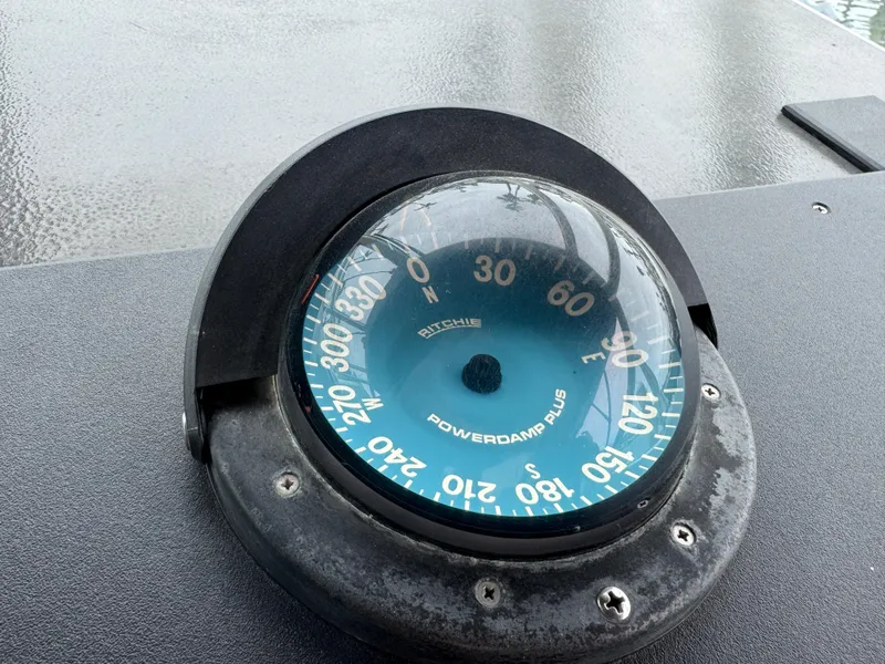 Compass on 1989 Tiara Yachts 3300 dashboard, displaying navigation degrees.