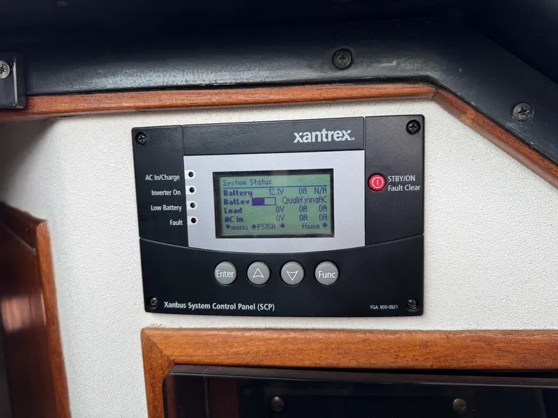 Xantrex system control panel on 1989 Tiara Yachts 3300, displaying battery and inverter status.
