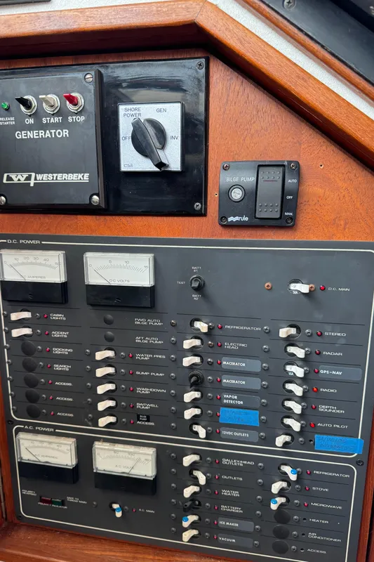 Control panel of a 1989 Tiara Yachts 3300, featuring generator and electrical switches.