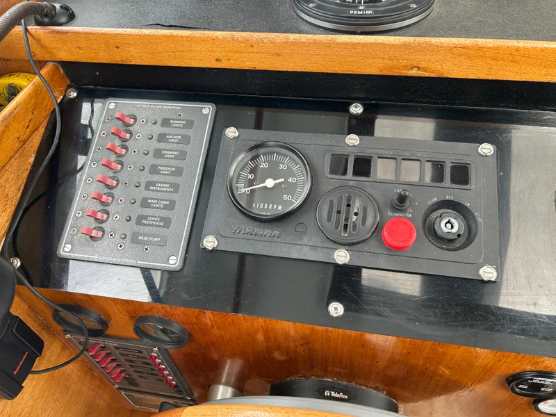 Control panel of a 1975 Fisher 30 Motorsailer with gauges and switches.