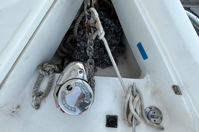 Anchor locker of 2007 Hunter 31 sailboat with ropes and chain.