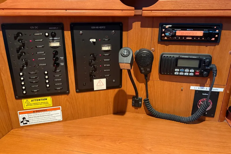 Electrical control panel of a 2007 Hunter 31 sailboat with communication devices.