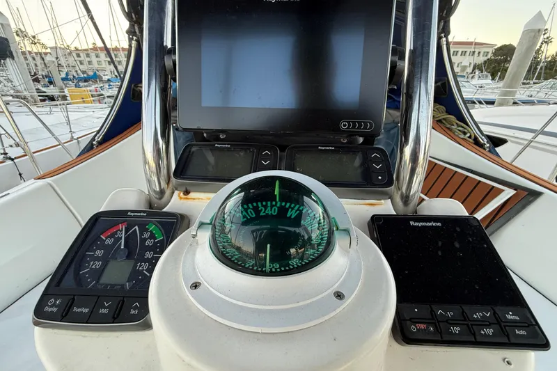 Cockpit of 2007 Hunter 31 sailboat with navigation instruments and compass.