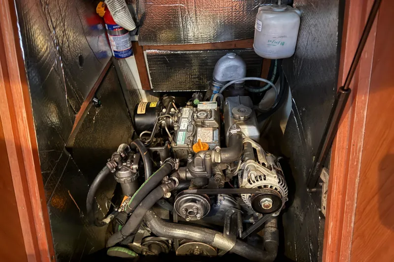 Engine compartment of a 2007 Hunter 31 sailboat, featuring detailed mechanical components.