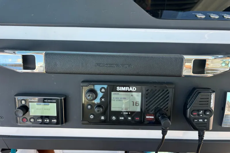 Control panel of 2022 Axopar 28 AFT CABIN with Simrad and Fusion devices.