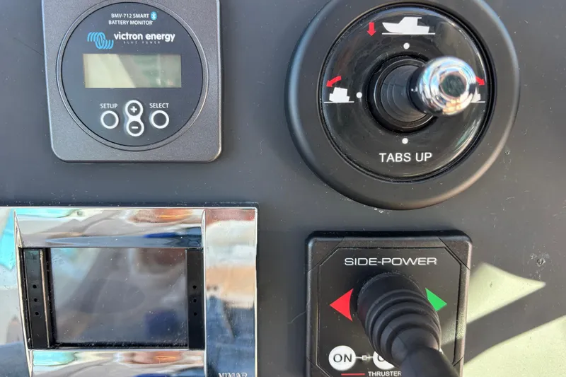 Control panel of 2022 Axopar 28 AFT CABIN with battery monitor and thruster controls.
