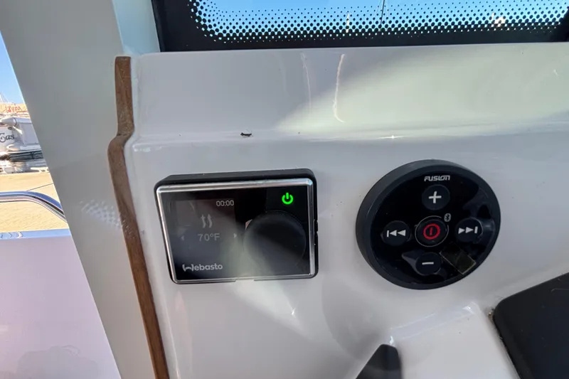Control panel of 2022 Axopar 28 AFT CABIN with Webasto and Fusion systems.