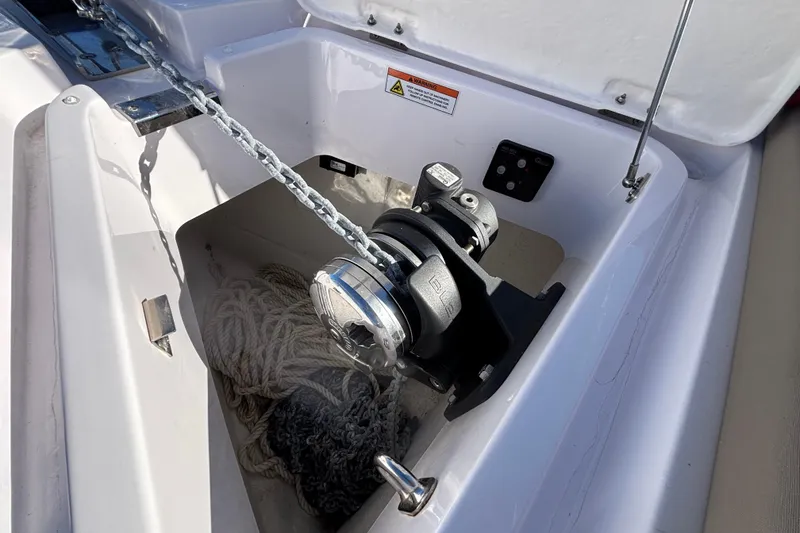Anchor winch system on 2022 Axopar 28 AFT CABIN boat, featuring chain and rope storage.