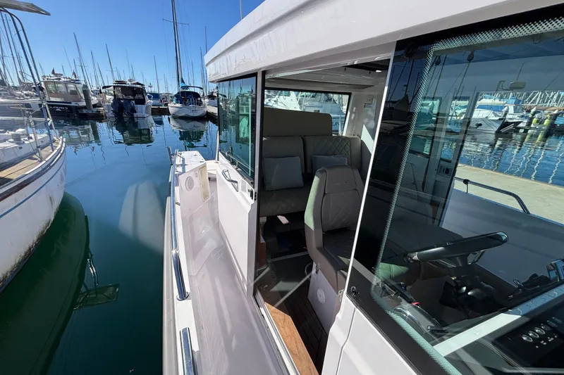 2022 Axopar 28 AFT CABIN boat docked at marina, interior view.