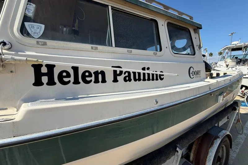 1996 C-Dory 22 boat named "Helen Pauline" on a trailer, side view.