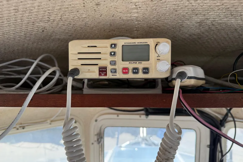 VHF radio on 1996 C-Dory 22 boat, featuring Standard Horizon Eclipse DSC model.