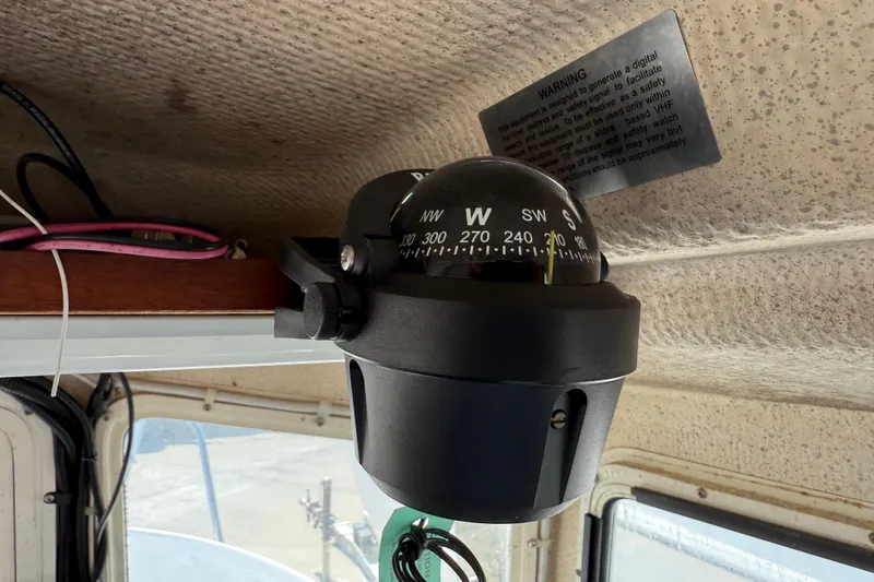 Compass inside a 1996 C-Dory 22 boat, mounted on the cabin ceiling.