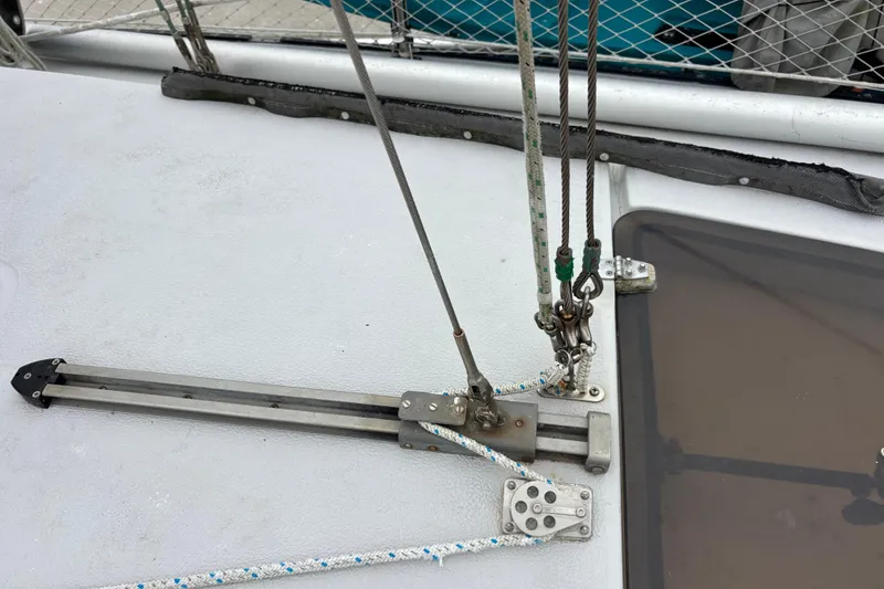 Deck rigging on 1979 Islander Peterson 40 sailboat, featuring ropes and pulleys.