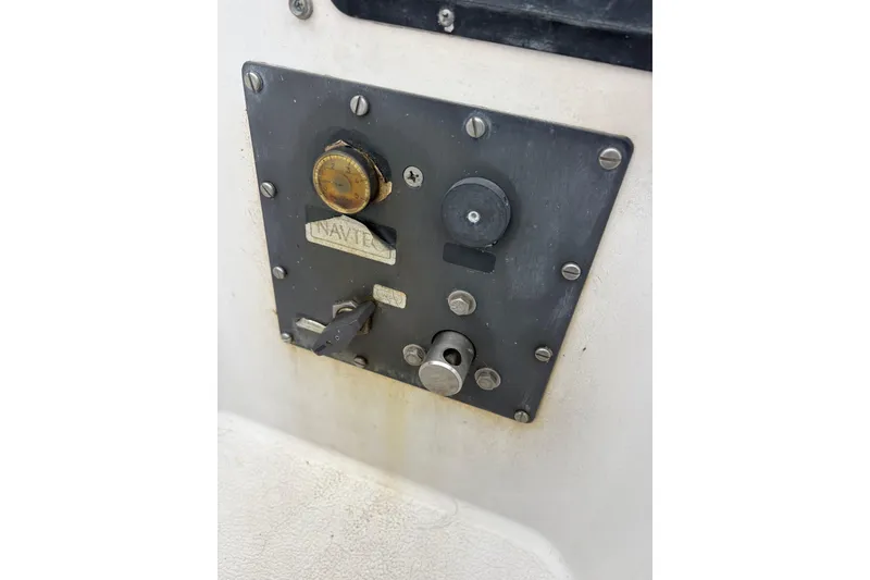 Control panel on 1979 Islander Peterson 40 sailboat, featuring various switches and dials.
