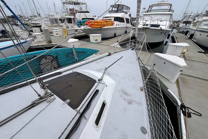 1979 Islander Peterson 40 sailboat docked among other boats at a marina.