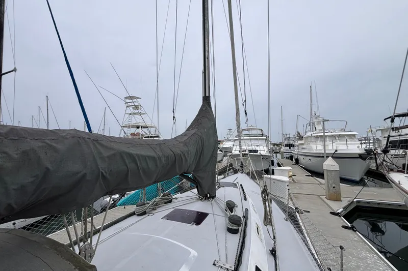 1979 Islander Peterson 40 sailboat docked among other boats in a marina.