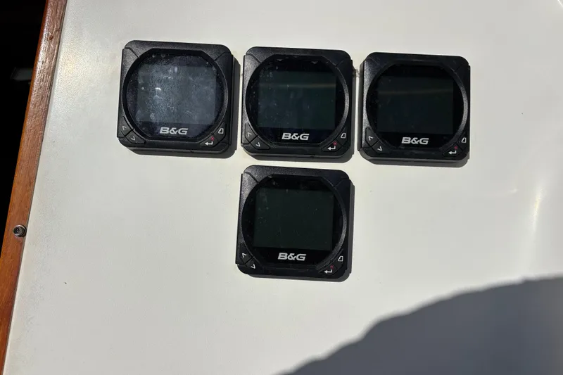 Four B&G marine instruments on a 1979 Islander Peterson 40 yacht dashboard.
