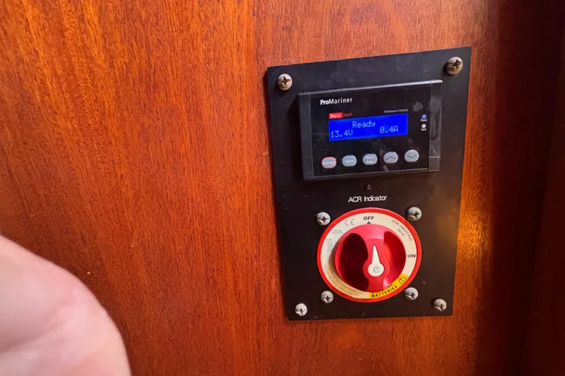 Control panel on 1979 Islander Peterson 40 sailboat, featuring ProMariner display and ACR indicator.