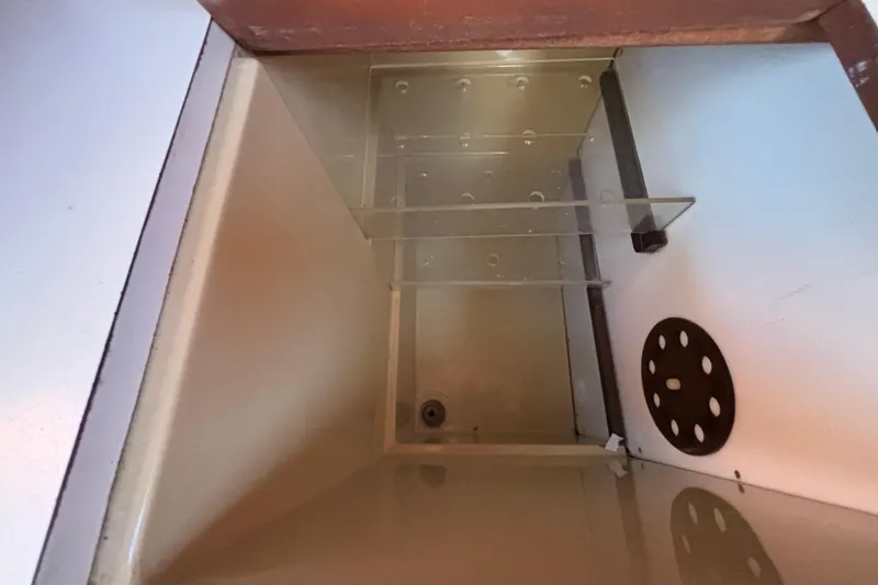 Interior compartment of a 1979 Islander Peterson 40 sailboat, featuring storage space.