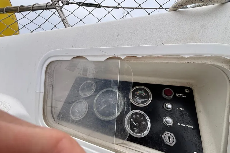 Control panel of a 1979 Islander Peterson 40 sailboat with gauges and buttons.