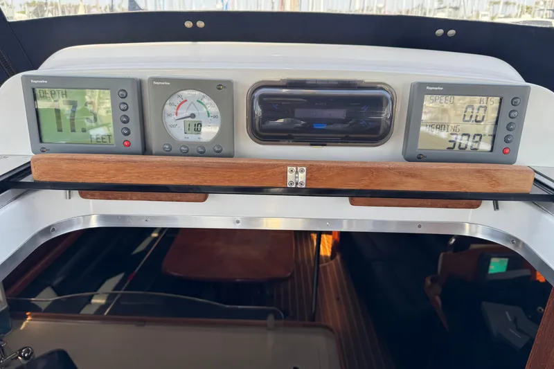 Control panel of a 2004 Hunter 41 Aft Cockpit sailboat with navigation instruments.