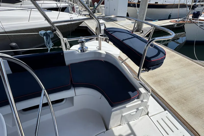 2004 Hunter 41 Aft Cockpit with blue cushions in marina.