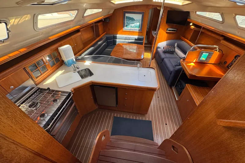 Interior of 2004 Hunter 41 Aft Cockpit yacht with wood finish and modern amenities.