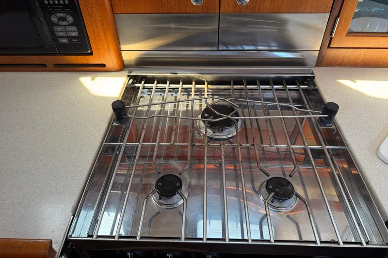 Stainless steel stove in 2004 Hunter 41 Aft Cockpit yacht kitchen.