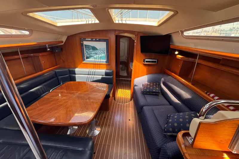 Luxurious interior of 2004 Hunter 41 Aft Cockpit yacht with elegant wood finish.